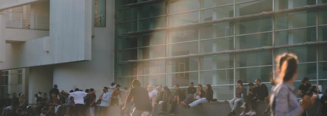 Students sitting on a college wall.jpg