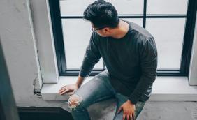 man-looks-out-window 2.jpg