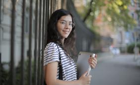 woman-in-black-and-white-striped-shirt-holding-laptop-3808811.jpg